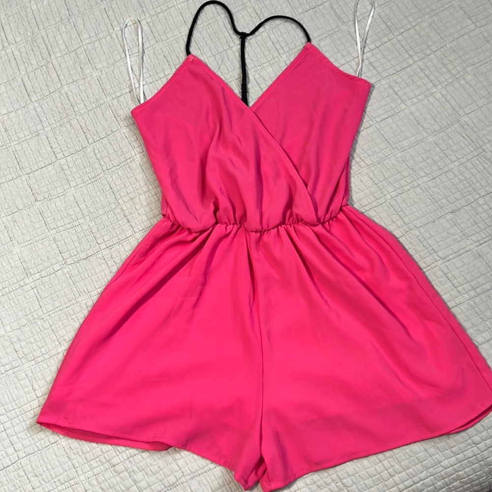 Pink open back Romper used once.